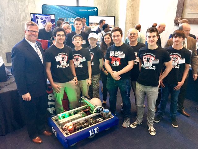 The team posing with a congress representative.