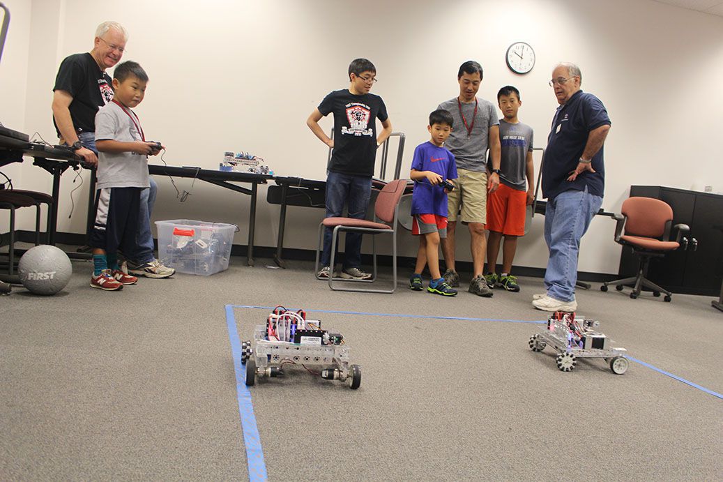 Children driving a robot.