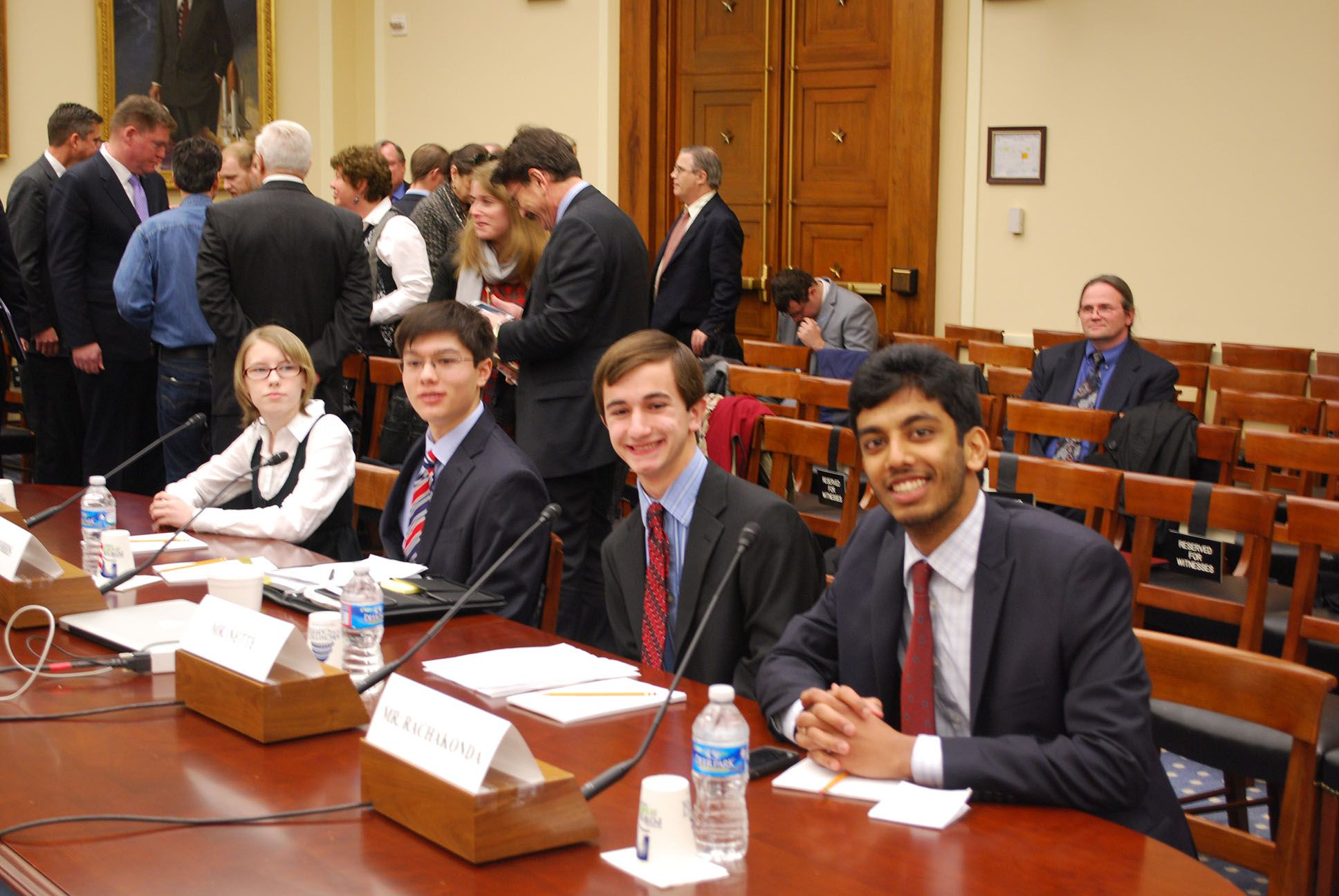 Team members posing in court.